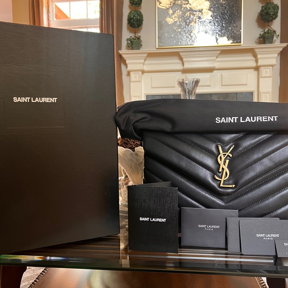 This a brand new never worn bag. It is authentic and purchased from Saks!